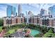 Beautiful courtyard view of a luxury building with lush landscaping and walkways in a vibrant urban setting at 300 W 5Th St # 644, Charlotte, NC 28202