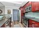 Well-lit kitchen featuring stainless steel appliances, contrasting countertops, and ample cabinet space at 300 W 5Th St # 644, Charlotte, NC 28202