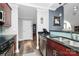 Well-designed kitchen with modern appliances, blue-tile backsplash, and a breakfast bar at 300 W 5Th St # 644, Charlotte, NC 28202