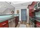 Modern kitchen featuring sleek stainless steel appliances, stylish backsplash, and rich, dark wood cabinets at 300 W 5Th St # 644, Charlotte, NC 28202