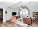 Bright living room with hardwood floors and a large window at 300 W 5Th St # 644, Charlotte, NC 28202