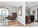 Open-concept living space with an arched window, and a modern kitchen featuring stainless steel appliances at 300 W 5Th St # 644, Charlotte, NC 28202