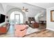 Open concept living room featuring a large sofa, marble table, and hardwood floors at 300 W 5Th St # 644, Charlotte, NC 28202