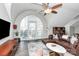 Bright living room with large window, modern furnishings and hardwood floors at 300 W 5Th St # 644, Charlotte, NC 28202