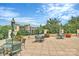 Spacious patio with tables, chairs, umbrellas, green landscaping, and a wonderful view at 300 W 5Th St # 644, Charlotte, NC 28202