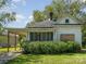 Charming home featuring a covered porch, mature landscaping and a carport, with the address clearly visible at 324 State St, Rock Hill, SC 29730