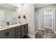 Bathroom featuring a double vanity sink, gray cabinets, and a glass-enclosed shower at 3401 Shillinglaw Rd, Sharon, SC 29742