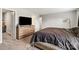 Carpeted bedroom featuring a dresser, large TV, and neutral walls, offering comfort and functionality at 3401 Shillinglaw Rd, Sharon, SC 29742