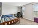 Bedroom featuring carpet flooring, a window, a bed with blue patterned covers, and a wooden frame at 3401 Shillinglaw Rd, Sharon, SC 29742