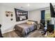 Bedroom with gray walls, neutral carpet, and a window with navy blue curtains, creating a cozy atmosphere at 3401 Shillinglaw Rd, Sharon, SC 29742