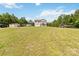 Spacious front yard with a two-story home, detached garage, and ample parking at 3401 Shillinglaw Rd, Sharon, SC 29742