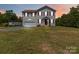 Charming two-story home with attached garage and well-maintained lawn at 3401 Shillinglaw Rd, Sharon, SC 29742