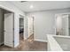 Upstairs hallway with neutral carpet and light gray walls provides access to bedrooms and bathrooms at 3401 Shillinglaw Rd, Sharon, SC 29742