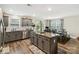 Spacious kitchen with stainless appliances, granite counters, gray cabinets, and adjacent dining area near backyard access at 3401 Shillinglaw Rd, Sharon, SC 29742