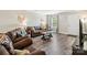 Living room features wood-look floors and comfortable brown leather furniture at 3401 Shillinglaw Rd, Sharon, SC 29742