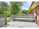 Relax on this grey wood deck with a lattice fence and built in bench at 3455 Hickory Pl, Salisbury, NC 28144