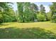 Lush, expansive backyard offers plenty of room for outdoor activities and serene relaxation at 3455 Hickory Pl, Salisbury, NC 28144