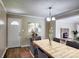 Elegant dining room with stylish decor, fireplace view, and modern lighting at 3455 Hickory Pl, Salisbury, NC 28144