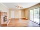 Bright living room featuring a brick fireplace, ceiling fan, and access to the outdoor deck at 3455 Hickory Pl, Salisbury, NC 28144
