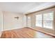 Sunny living room with fresh paint, wood floors, and a view of the front yard at 3455 Hickory Pl, Salisbury, NC 28144