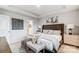 The main bedroom features a king bed, bench, and ample natural light, creating a relaxing retreat at 3922 Cheyney Park Dr, Charlotte, NC 28269