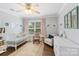 Well-lit Bedroom with a crib, rocking chair, decorative rug, and plenty of natural light at 423 State St, Charlotte, NC 28208