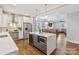 Open-concept kitchen featuring a large island, modern appliances, and a seamless view into the dining and living areas at 423 State St, Charlotte, NC 28208