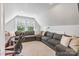 Bright living area with a cozy, neutral sectional sofa, complemented by natural light from large windows at 423 State St, Charlotte, NC 28208