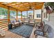Relaxing covered patio featuring comfortable seating, a ceiling fan, and an outdoor television for entertainment at 423 State St, Charlotte, NC 28208