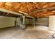 Unfinished basement with block walls, a small window, and exposed ceiling at 462 Berry Hill Dr, Norwood, NC 28128