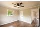 Bedroom with wood floors, a ceiling fan, and a closet at 462 Berry Hill Dr, Norwood, NC 28128