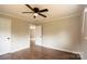 Bedroom features hardwood floors, a ceiling fan, and a large doorway at 462 Berry Hill Dr, Norwood, NC 28128