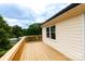 Spacious wooden deck offering scenic views, perfect for outdoor entertaining at 462 Berry Hill Dr, Norwood, NC 28128