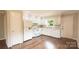 Well-lit kitchen with white appliances, lots of cabinet space and modern design at 462 Berry Hill Dr, Norwood, NC 28128
