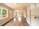 Bright living room with wood floors, neutral paint, ceiling fan, and views to the deck at 462 Berry Hill Dr, Norwood, NC 28128
