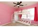 Pink bedroom with bunk beds, ceiling fan and light coming in from a window at 4642 Laurendale Ct, Rock Hill, SC 29732