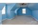 An airy bedroom with a pitched roof features sky blue walls and ample windows at 4642 Laurendale Ct, Rock Hill, SC 29732