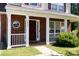 Inviting front porch with white columns and charming details at 4642 Laurendale Ct, Rock Hill, SC 29732