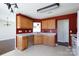 Kitchen with stainless steel dishwasher, wood cabinets, and light countertops at 4642 Laurendale Ct, Rock Hill, SC 29732