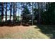 A pergola offers a charming focal point in a tranquil, wooded backyard setting at 4642 Laurendale Ct, Rock Hill, SC 29732