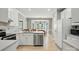 Well-lit kitchen with stainless steel appliances, and an adjacent dining area at 4860 Sherborne Dr, Harrisburg, NC 28075