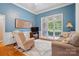 Bright living room with natural light, neutral decor, hardwood floors, and a comfortable seating arrangement at 4860 Sherborne Dr, Harrisburg, NC 28075