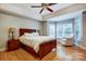 Spacious primary bedroom with hardwood floors, tray ceilings and lots of natural light at 4860 Sherborne Dr, Harrisburg, NC 28075