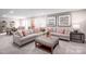 Cozy living room with comfortable sofas, decorative pillows, and stylish furnishings at 518 Durango Way, Denver, NC 28037