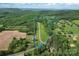 Stunning aerial view of property with approximate lot lines highlighted in blue at 536 Brookhaven Rd, Statesville, NC 28625