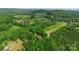 Wide aerial view of the property and the vast expanse of green fields and forested hills at 536 Brookhaven Rd, Statesville, NC 28625