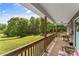 Spacious covered back porch offers outdoor seating with a view of the lush green yard at 536 Brookhaven Rd, Statesville, NC 28625