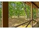 Scenic backyard view with lush trees and a wooden fence creating a private and serene outdoor space at 536 Brookhaven Rd, Statesville, NC 28625