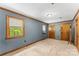 Spacious bedroom with neutral carpet, wood trim, and a well-lit, airy feel at 536 Brookhaven Rd, Statesville, NC 28625