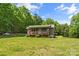 Charming home with a covered front porch surrounded by lush greenery at 536 Brookhaven Rd, Statesville, NC 28625